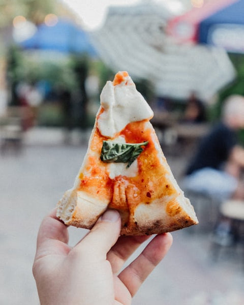 How long does it take to cook a pizza in a commercial oven?